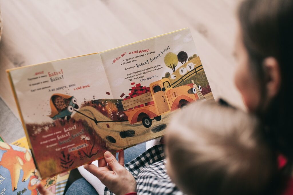 lady reading book for toddler